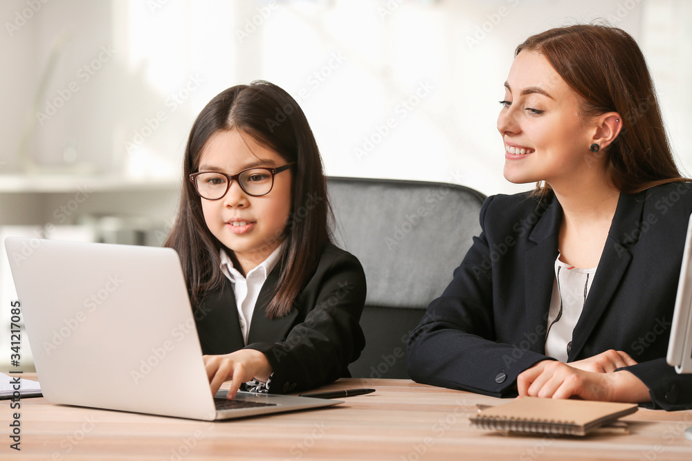 Cute little businesswoman with client in office Cute little businesswoman with client in office