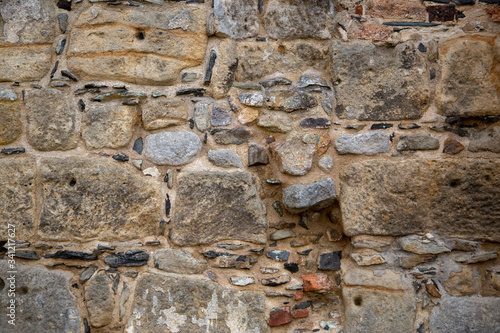 A wall of natural -or sandstone as background or texture