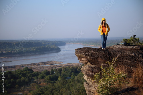 Woman standing on the cliff at Pha Tam National Park  Ubon Ratchathani  Thailand.