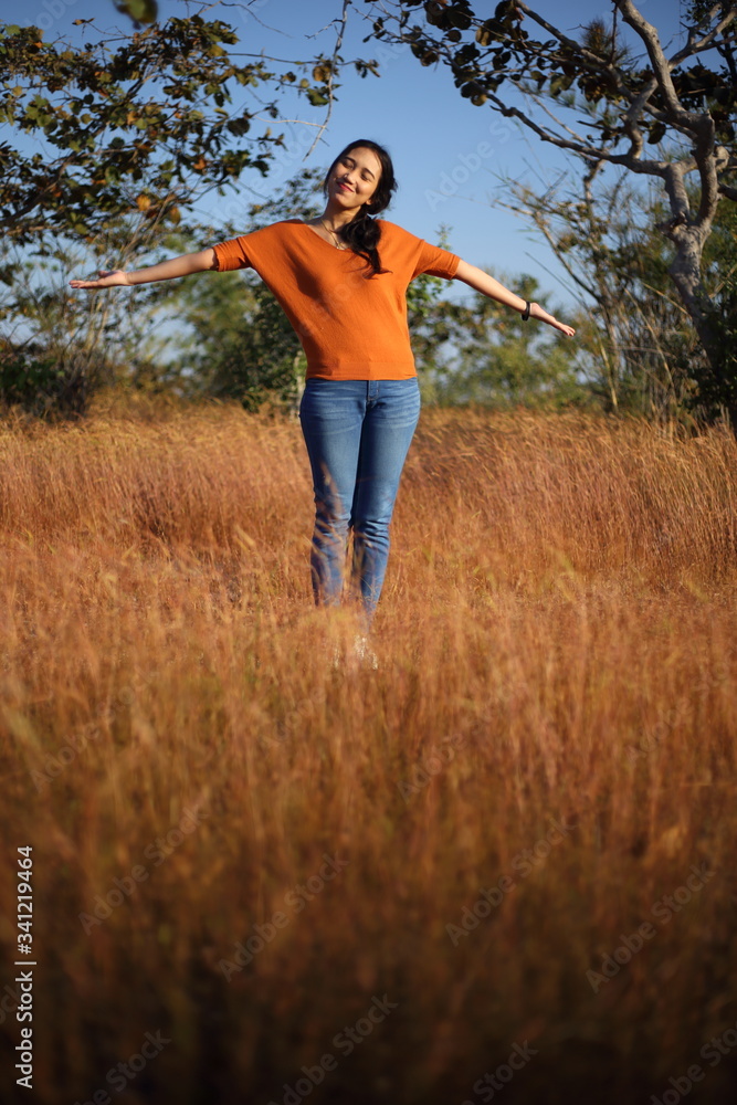 Women enjoying grasslands at Pha Taem National Park, Ubon Ratchathani, Thailand Women enjoying grasslands at Pha Taem National Park, Ubon Ratchathani, Thailand