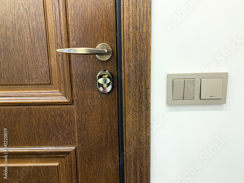 Wooden front door. Metal br...