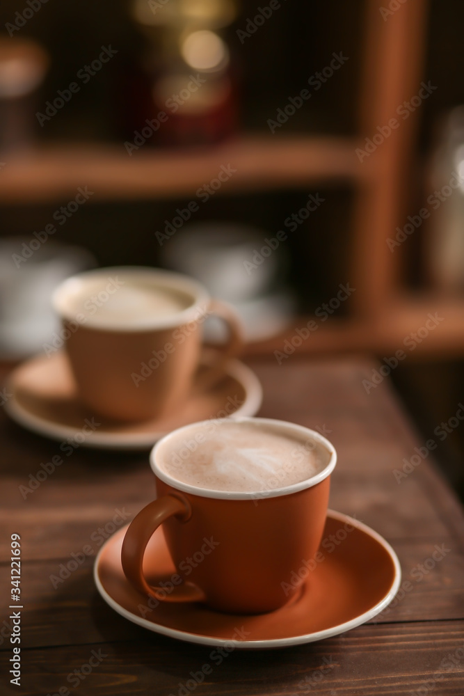 Cup of tasty cappuccino on table in cafe Cup of tasty cappuccino on table in cafe