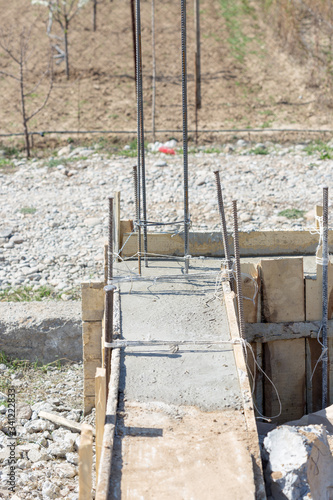 Formwork for the foundation of the house. Close-up of the foundation of a house made of concrete formwork blocks filled with mortar and reinforcement