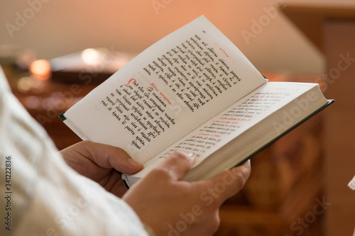 Bible in the hands of a priest