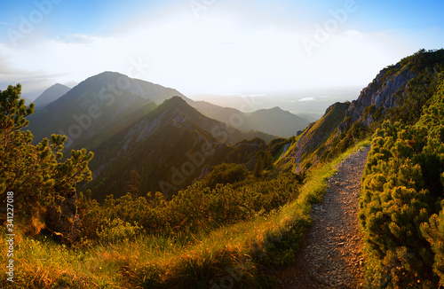 Murais de parede hiking trail at herzogstand mountain, evening in the bavarian alps