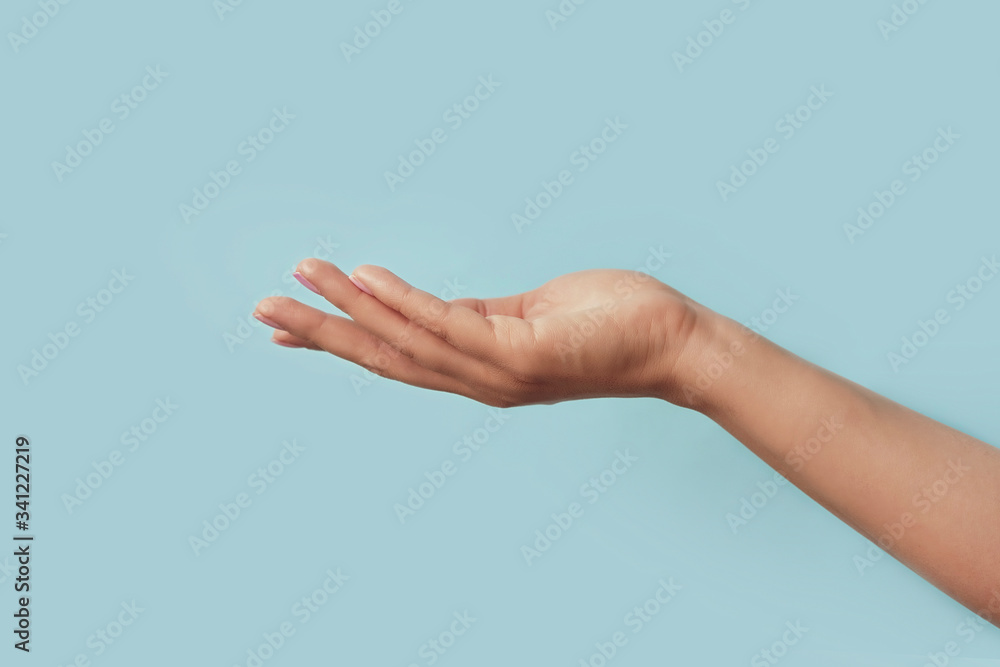 Beautiful elegant manicured hands on the background. hand skin care concept.
