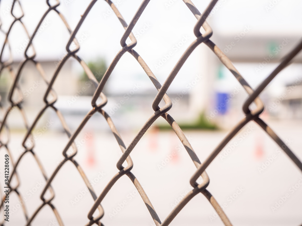 Wire fencing beside each other, the line between the road and the canal Wire fencing beside each other, the line between the road and the canal