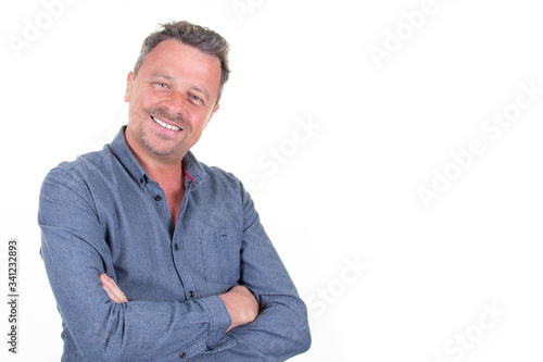 handsome business man dressed in casual blue shirt aside copy space isolated on white background © OceanProd
