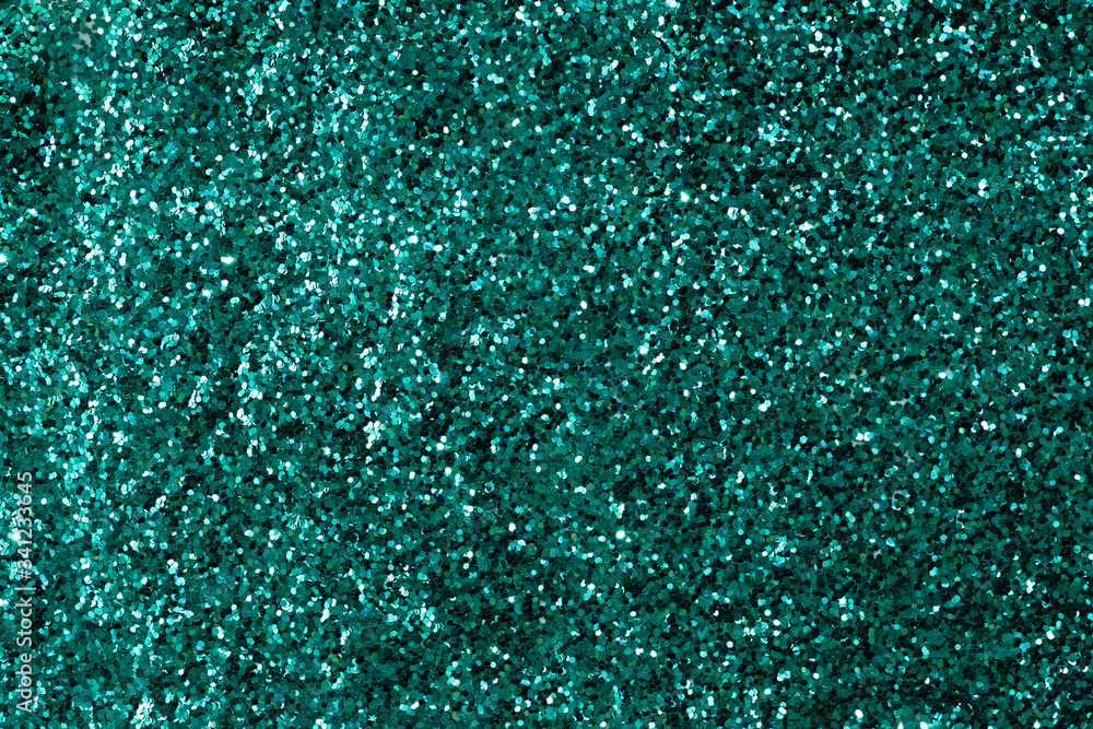 Shiny green glitter textured background Shiny green glitter textured background