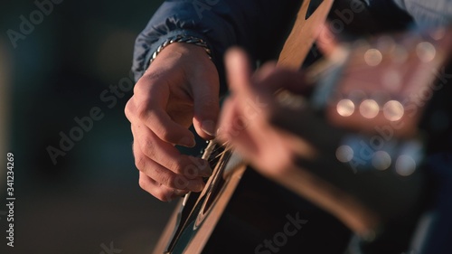 Man playing guitar with slow motion shoot music musician classic chord acoustic. Use for illustration or insert