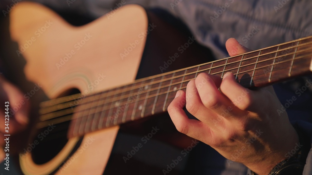 Man playing guitar with slow motion shoot music musician classic chord acoustic. Use for illustration or insert