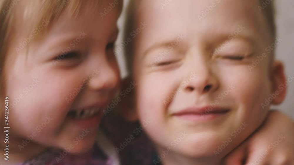 brother and sister laugh together. children are happy brother and sister laugh together. children are happy