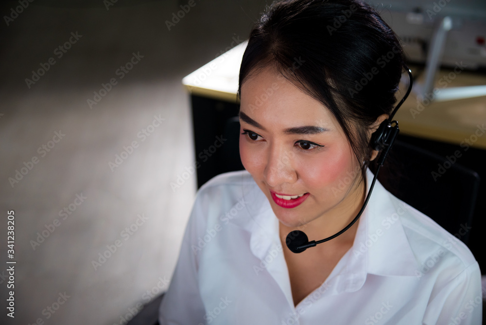 Asian call center business people with confidence working late night shift for helping assistance customer in workplace at night time Asian call center business people with confidence working late night shift for helping assistance customer in workplace at night time