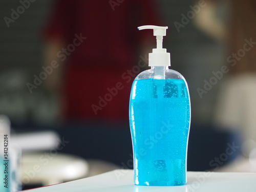 Hand Sanitizer, gel alcoholic mixture with gelatin in clear Plastic bottle with pump pushing wash clean dirty to prevent germs protect Contagious disease corona virus, covid-19 photo