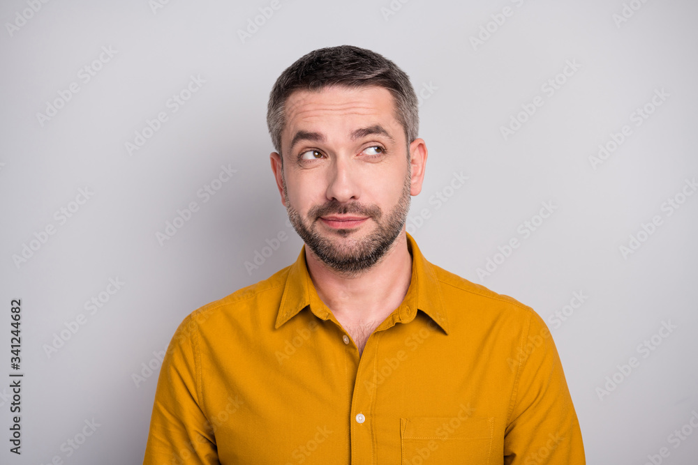 Portrait of interested mature man look copy space think thoughts plane his future family weekend wear stylish modern outfit isolated over gray color background Portrait of interested mature man look copy space think thoughts plane his future family weekend wear stylish modern outfit isolated over gray color background