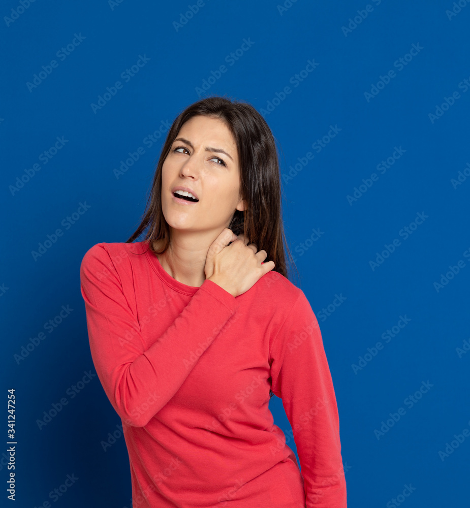 Fototapeta premium Brunette young woman wearing a red T-shirt