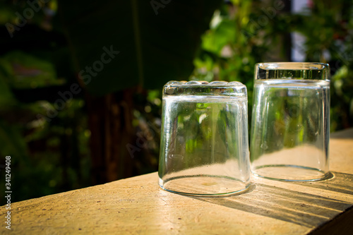 Outdoor Tea pouring into glass cup transparent with day sunlight. 