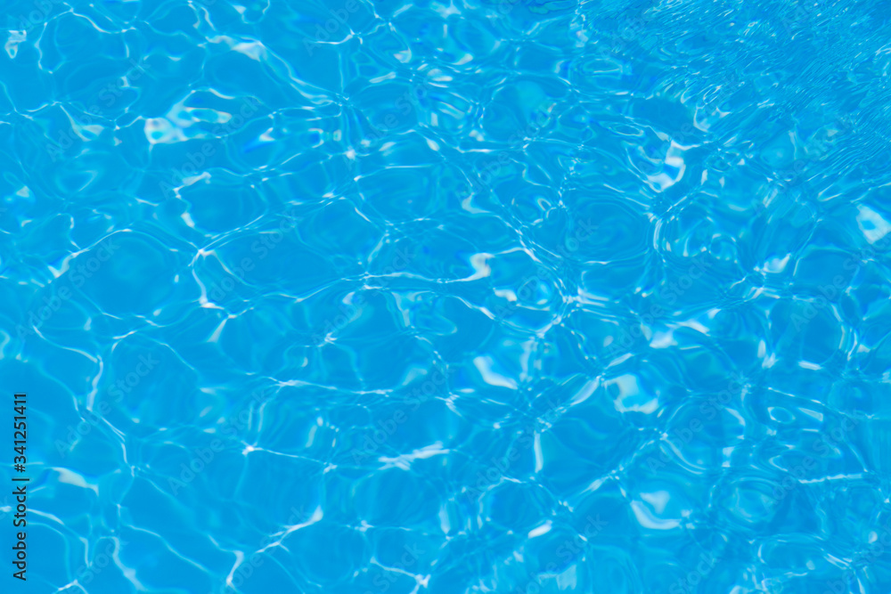 Blue water ripple reflection in the swimming pool