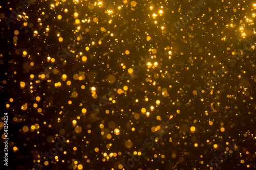 Golden blur glitter lights abstract bokeh for Merry Christmas and New Year