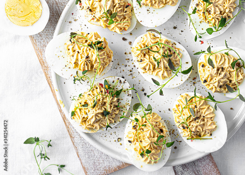Deviled eggs on a white plate photo