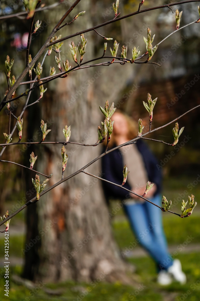 Stockholm, Sweden A woman enjoys the spring sunshine in a park. Stockholm, Sweden A woman enjoys the spring sunshine in a park.