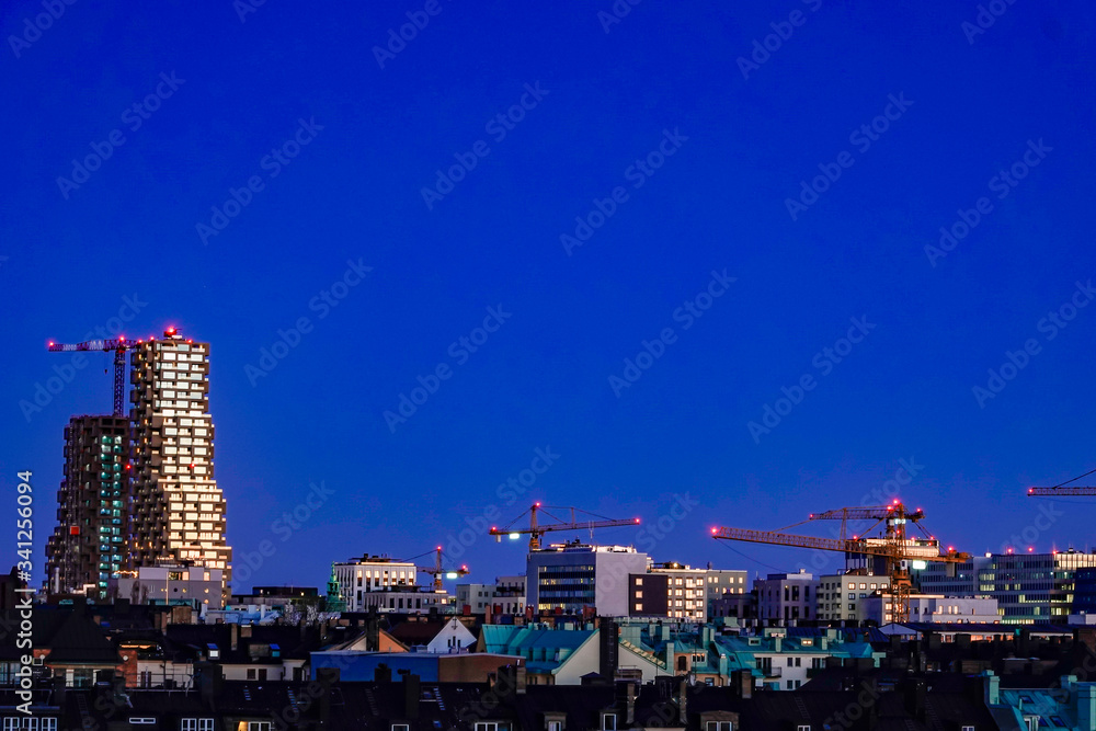 Naklejka premium Stockholm, Sweden The newly built Norra Tornen building at dawn contrasting with its surroundings.