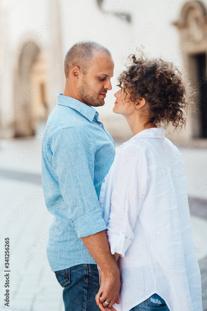 Fototapeta premium guy and a girl happily walk in the morning on the empty streets