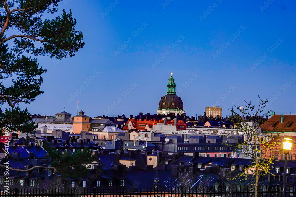 Stockholm, Sweden The rooftops of Kungsholmen at dawn and the church at Odenplan, Gustav Vasa Church