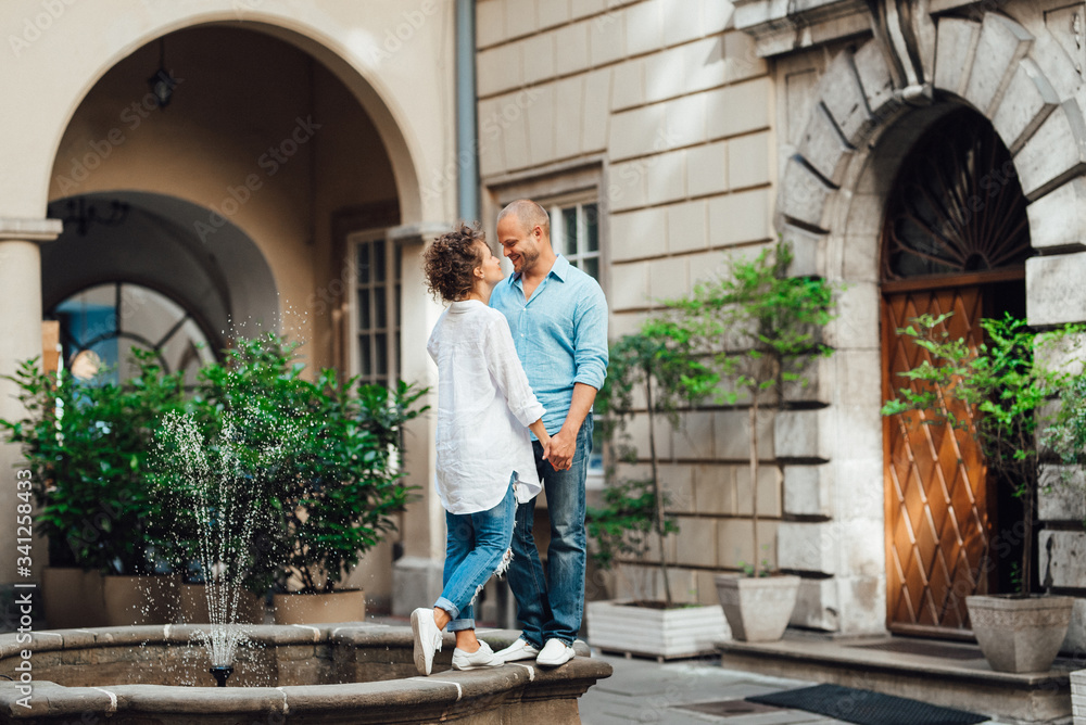 guy and a girl happily walk in the morning on the empty streets