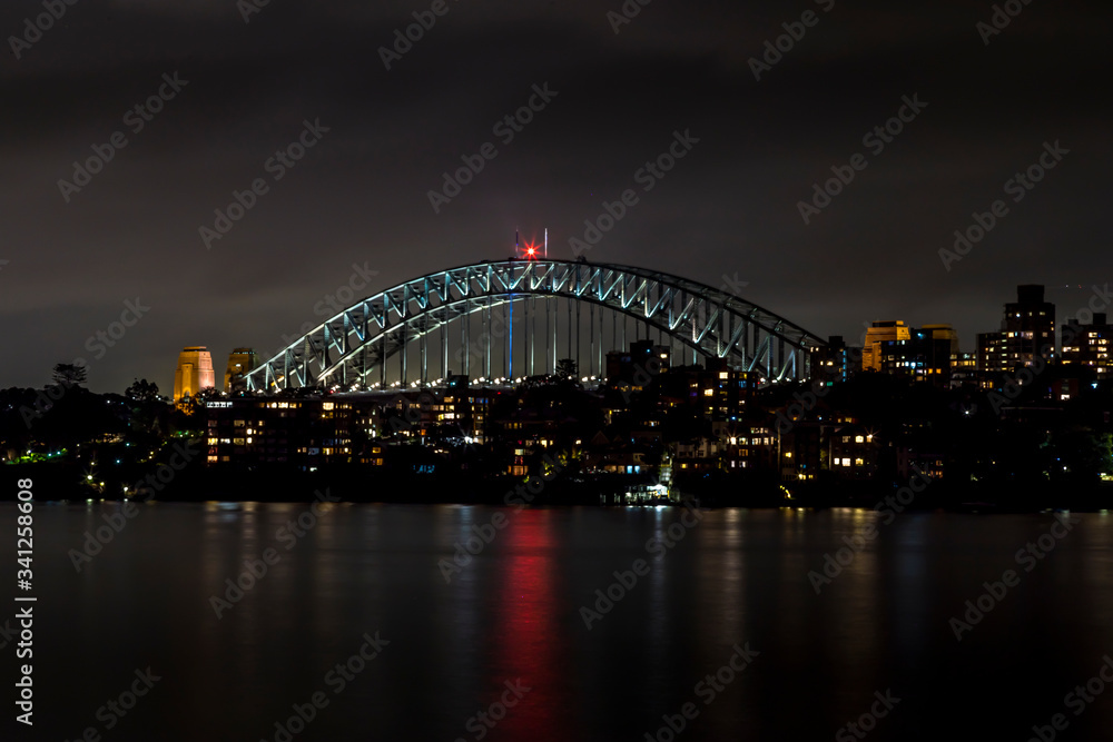 Sydney, Australia - 12th February 2020: A German photographer visiting Sydney in Australia, taking pictures of the Harbour Bridge at night.