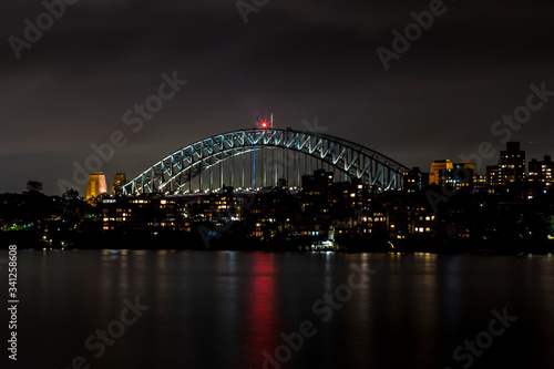Sydney, Australia - 12th February 2020: A German photographer visiting Sydney in Australia, taking pictures of the Harbour Bridge at night. © ms_pics_and_more