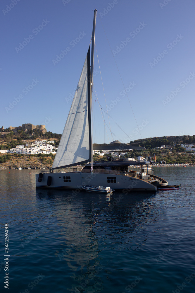 Sea port, sailing yachts stand on the pier.