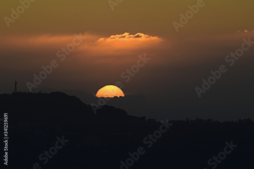 the sunset behind the hill © Pasqualino