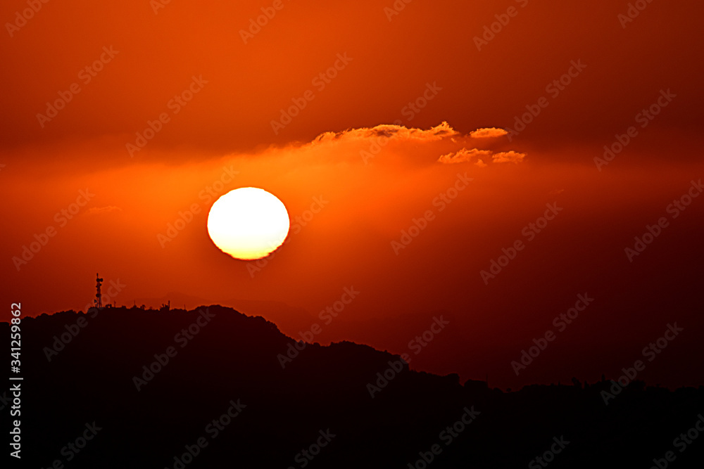 the sunset behind the hill the sunset behind the hill