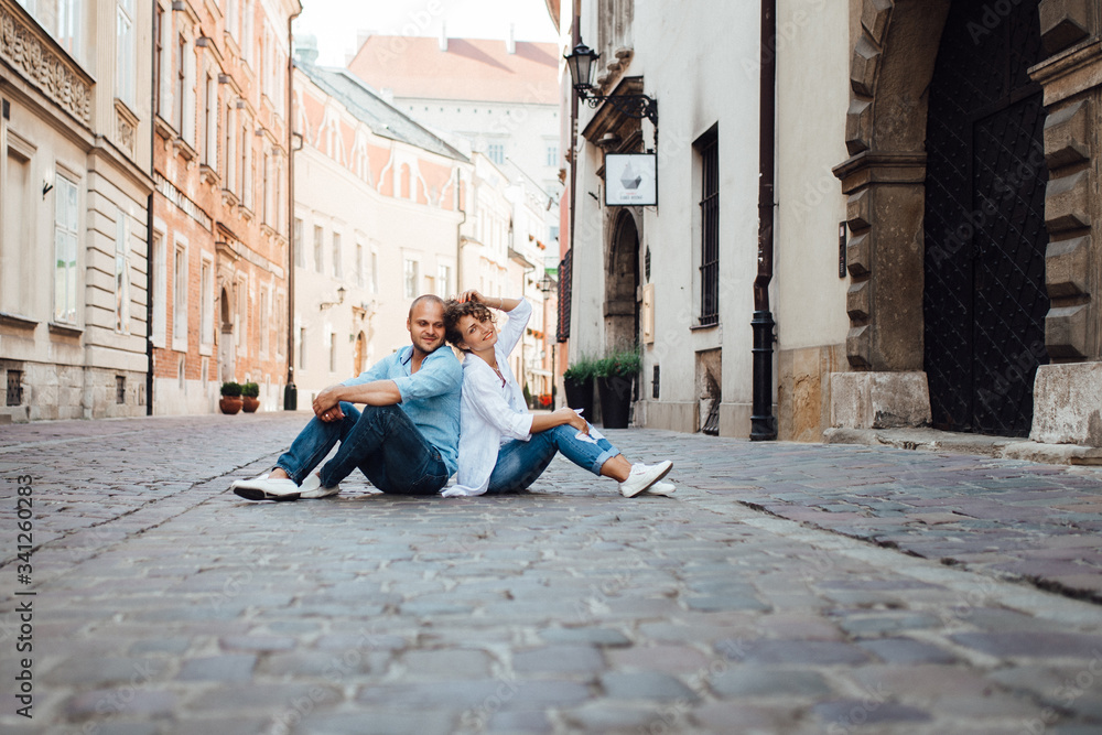 guy and a girl happily walk in the morning on the empty streets guy and a girl happily walk in the morning on the empty streets