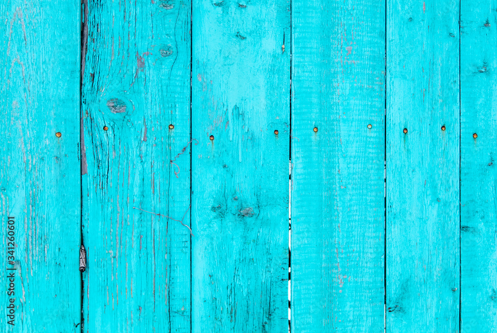 Wooden boards on an old blue fence as an abstract background. Wooden boards on an old blue fence as an abstract background.