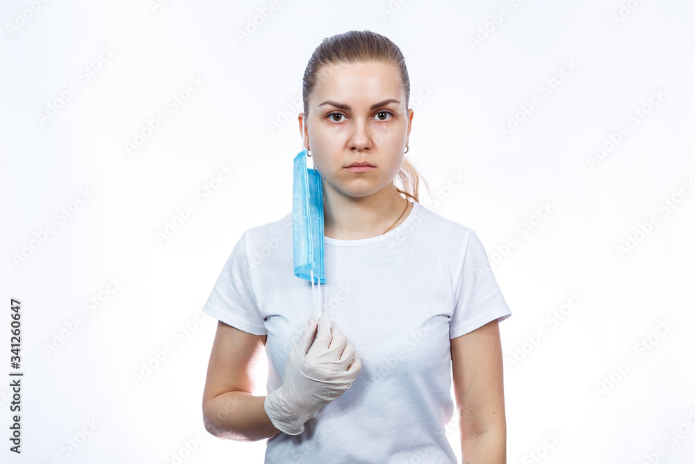 woman health worker in protective medical surgical mask against the virus. Isolated on white background woman health worker in protective medical surgical mask against the virus. Isolated on white background