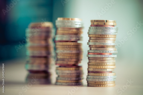 Market crisis and financial aid concept: Coins tacked on each other. Inflation, currency, savings, money