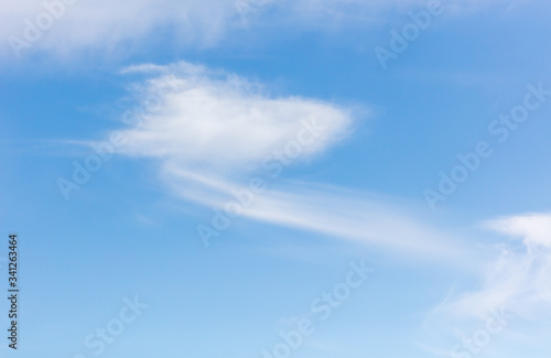 White clouds on a blue sky as background