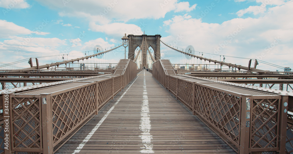 Fototapeta premium DX EST Super wide angle view, establishing shot of a Brooklyin bridge in New York, USA. No people walking on usually crowded bridge during coronavirus pandemic