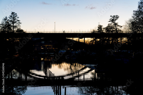 STOCKHOLM, SWEDEN; March 21 2019: Urban magical reflections in Swedish sunset. Långholmsbron bridge.