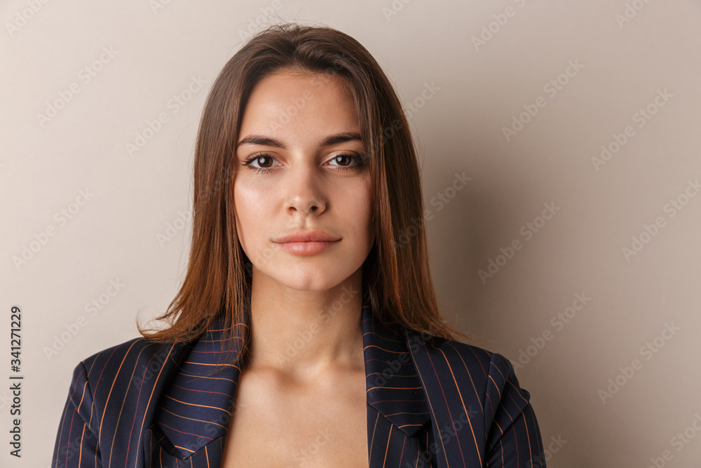 Photo of young businesswoman posing and looking at camera Photo of young businesswoman posing and looking at camera