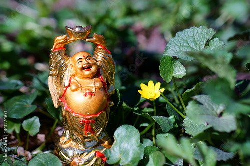 The statue of Buddha in close-up.