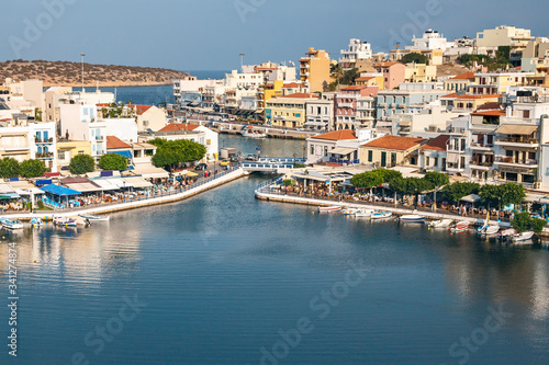 top view of a quiet bay and the Greek resort town of Agios Nikolaos on a sunny summer day © westermak15