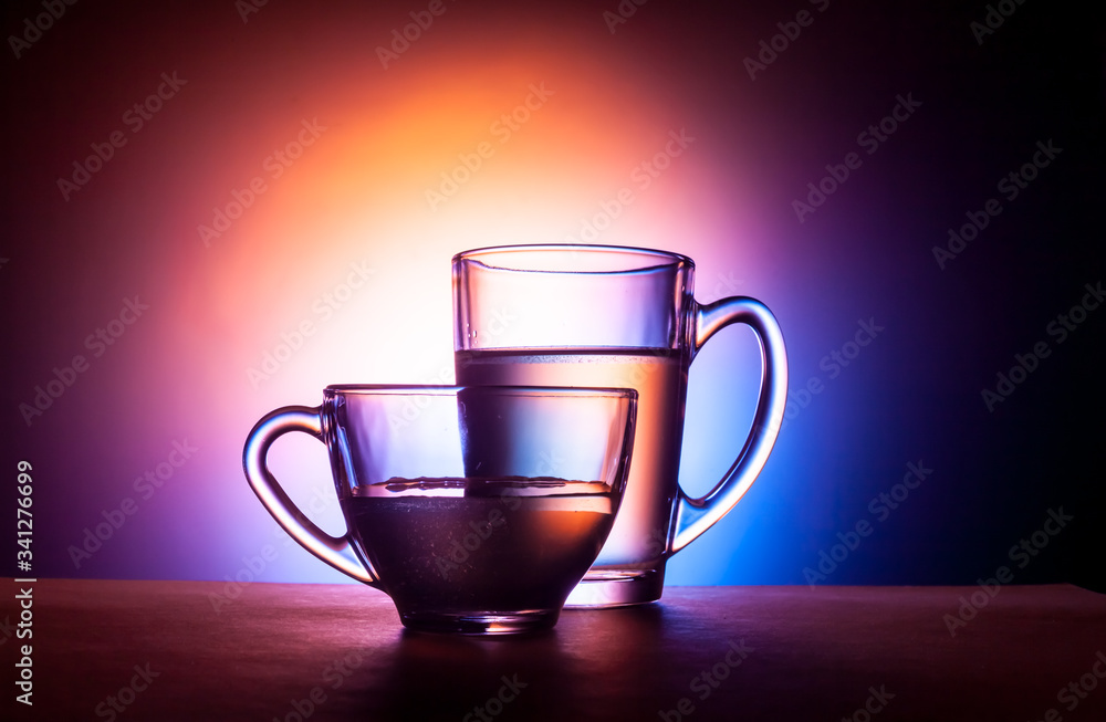 glass tea mugs. shot in the clear. concept of glassware. glass tea mugs. shot in the clear. concept of glassware.