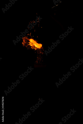 flame of fire with sparks on a neutral black background