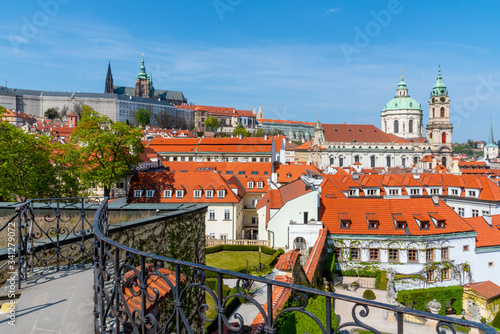 Prague Castle and St Nicholas Church in Lesser Town of Prague. Sunny spring day view from Vrtba Garden. Prague, Czech Republic photo