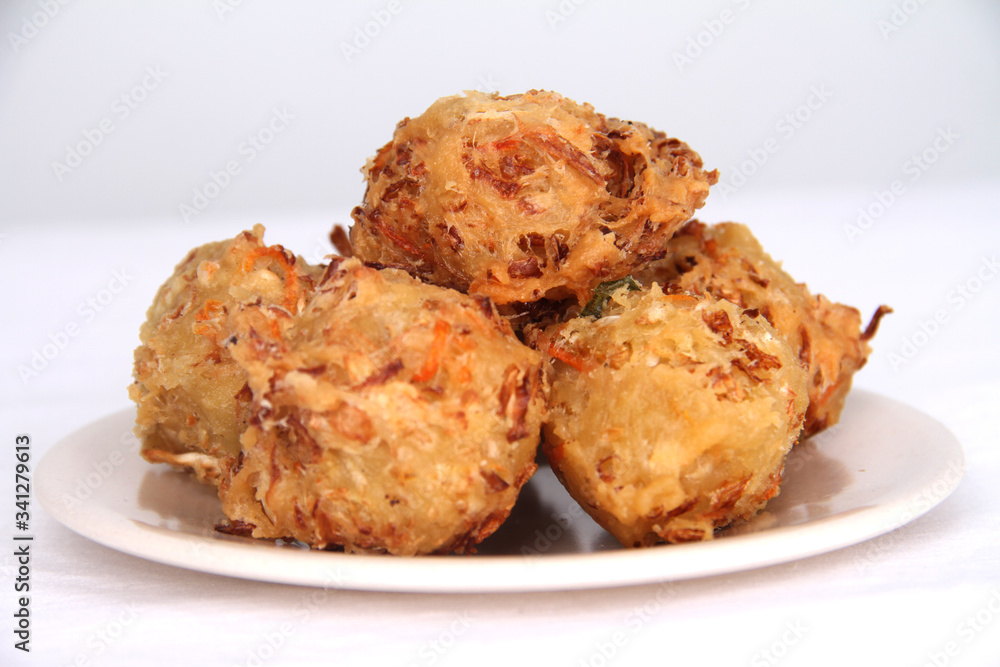 Traditional Indonesian Vegetable Fritters Snack called “Bakwan” or “Gorengan” Traditional Indonesian Vegetable Fritters Snack called “Bakwan” or “Gorengan”