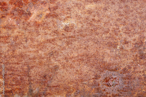 Oxidized metal surface, rust on iron surface, abstract rusty metal panel texture background. © Aleksandr
