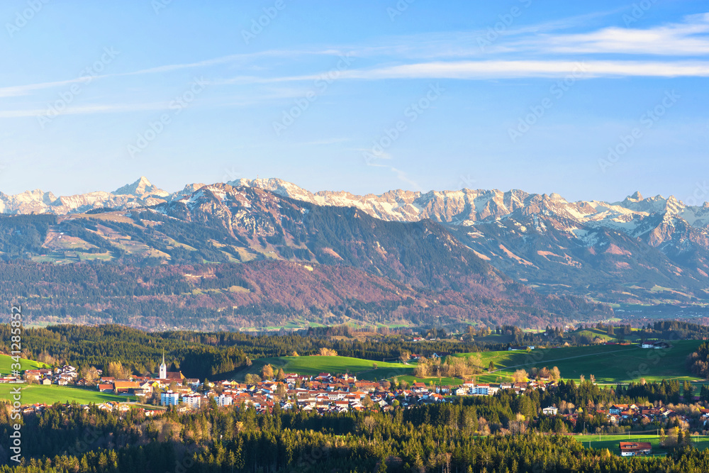 Village Buchenberg in front of the Allgäu Alps. Bavaria, Germany